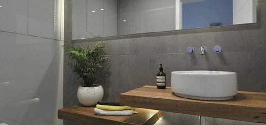 Baño Estilo moderno Color marron, gris, negro  diseñado por Serveis Generals. JW | Gremio 