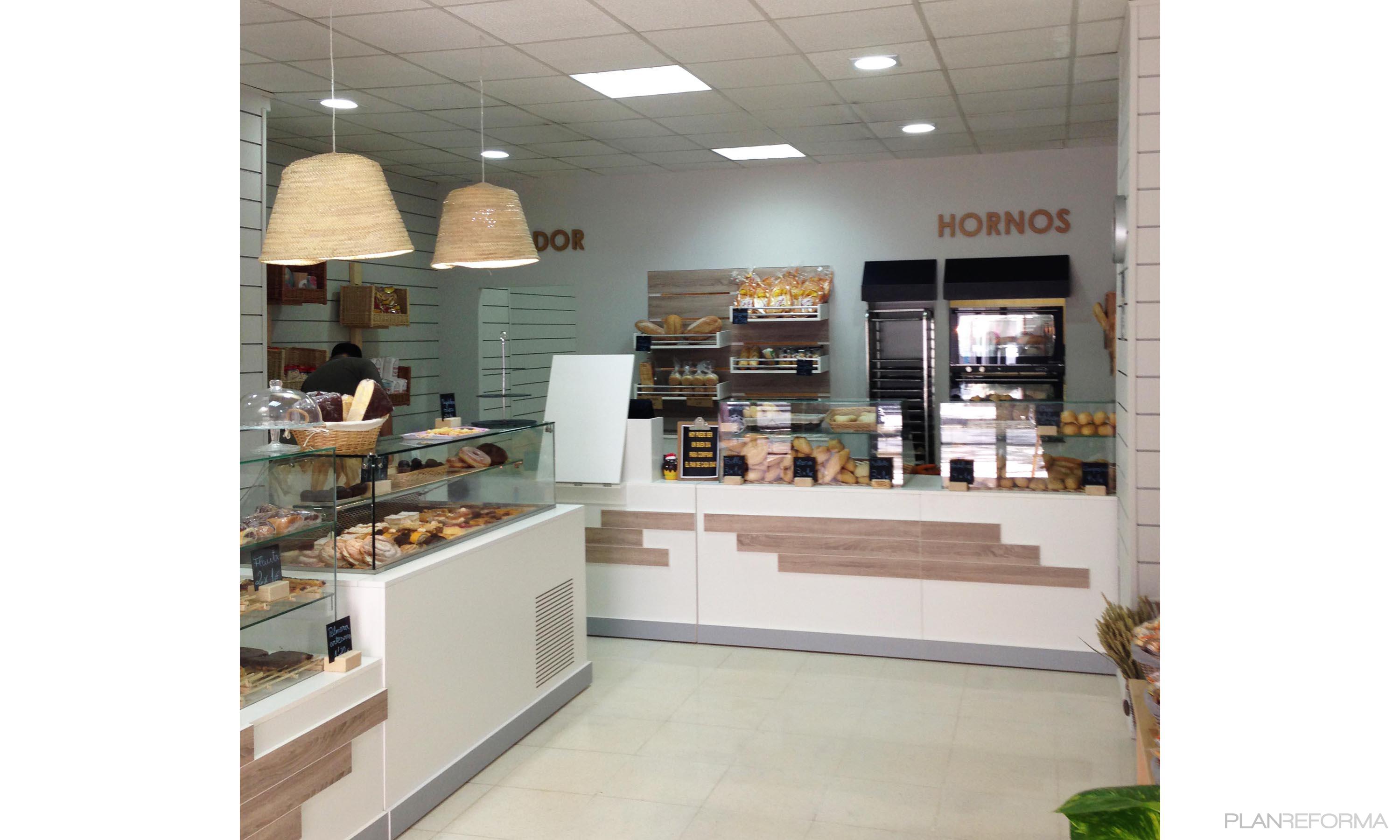 Tienda style moderno color marron, blanco, gris  diseñado por lacooperativa arquitectos S.C. | Arquitecto 